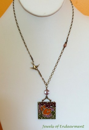 Poppy Booklet Necklace  A burst of sunlit bloom opens to reveal a delicate butterfly winging his way through the fields