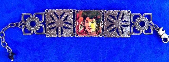 A Klimt beguiling beauty is illuminated delicately with glowing warm tints.